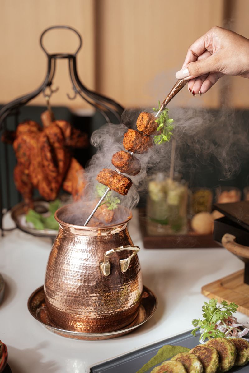 Food photograph by Hiren: skewers over a copper pot