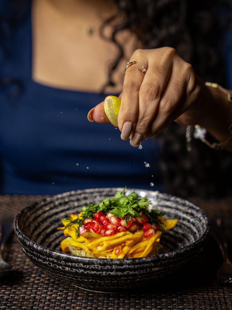 Food photograph by Hiren: lime squeezed over a salad
