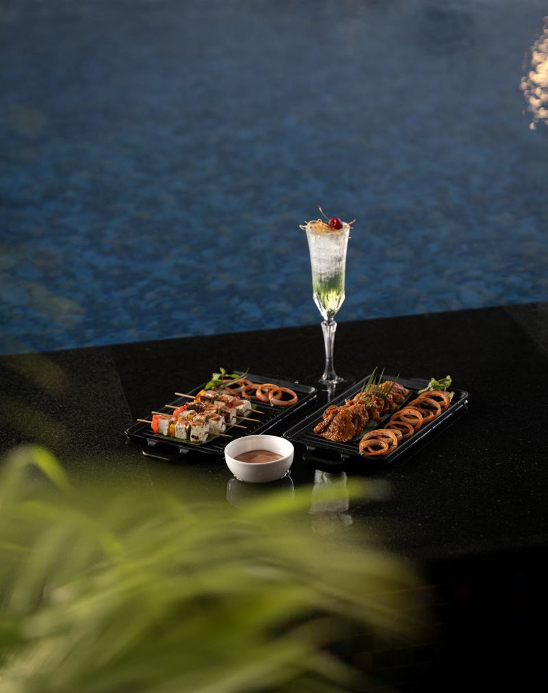 Food photograph by Hiren: sushi and a drink by a pool