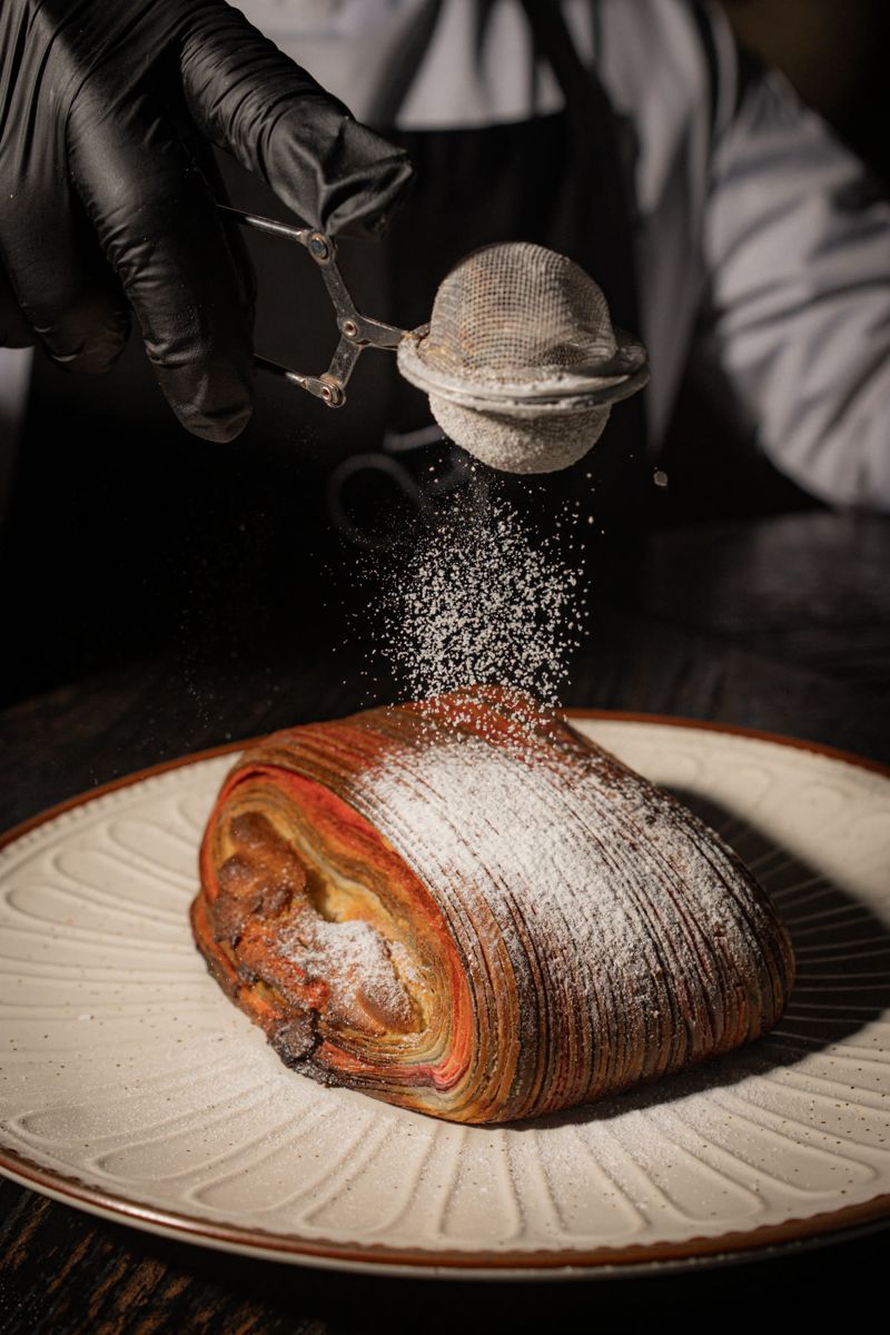 Food photograph by Hiren: sugar dusted onto a pastry